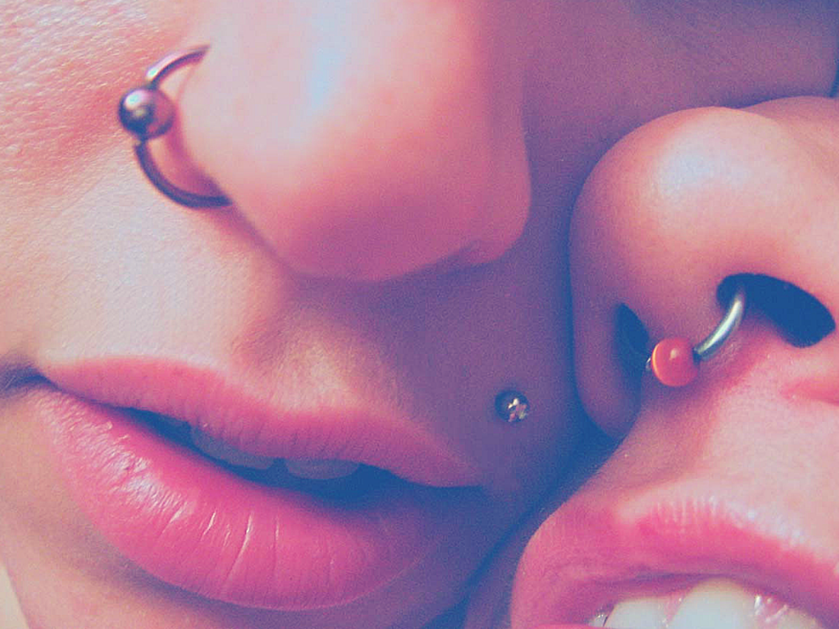two women with septum piercings