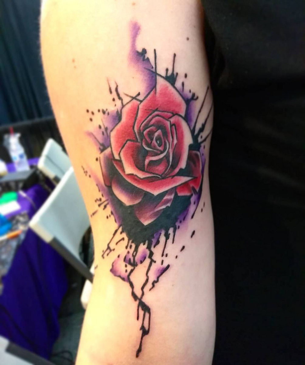 This rose tattoo has some interesting features that leave it open to interpretation.