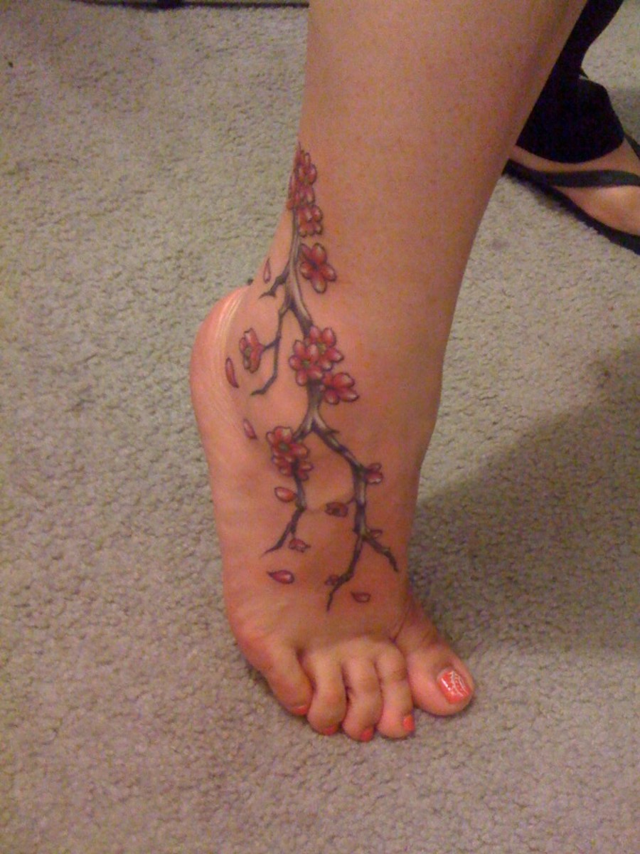 A cherry blossom ankle tattoo.