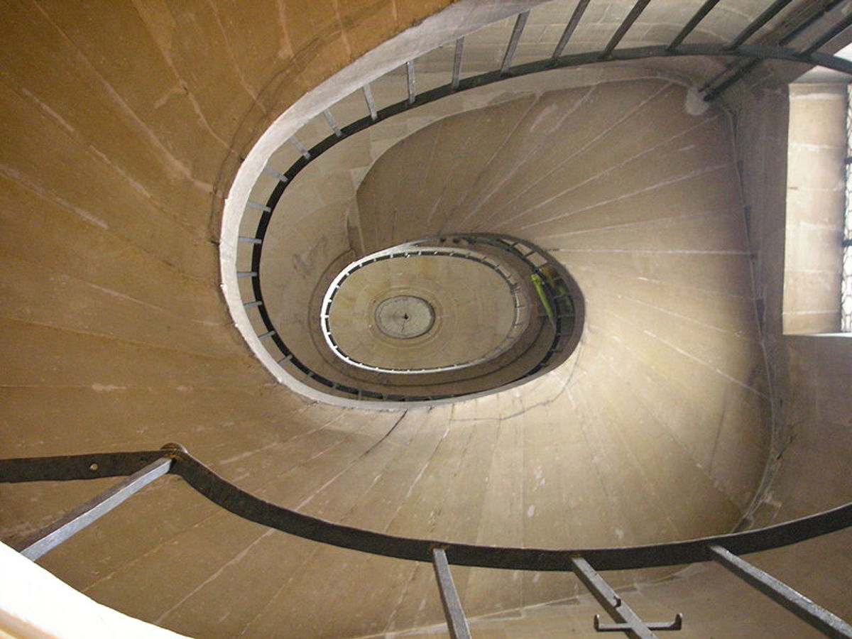 Poetry and Life Transitions can be symbolized in the spirals of a stairway leading up or down. [Photos on this page, public domain.]