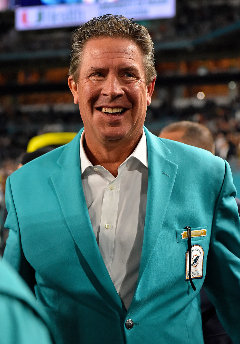 Former Dolphins quarterback Dan Marino looks on from the sidelines in a game against the Patriots at Hard Rock Stadium.