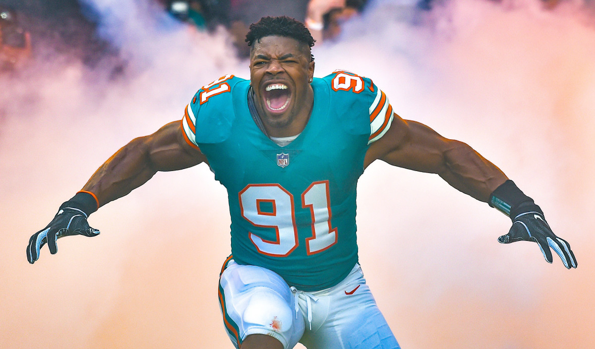 Dolphins defensive end Cameron Wake (91) is being introduced before a game against the Jaguars at Hard Rock Stadium.