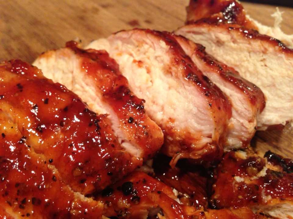 Barbecued boneless and skinless chicken breast with homemade bbq sauce