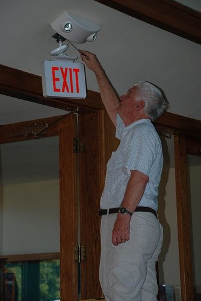 This is a common set up: an emergency light with an exit sign.