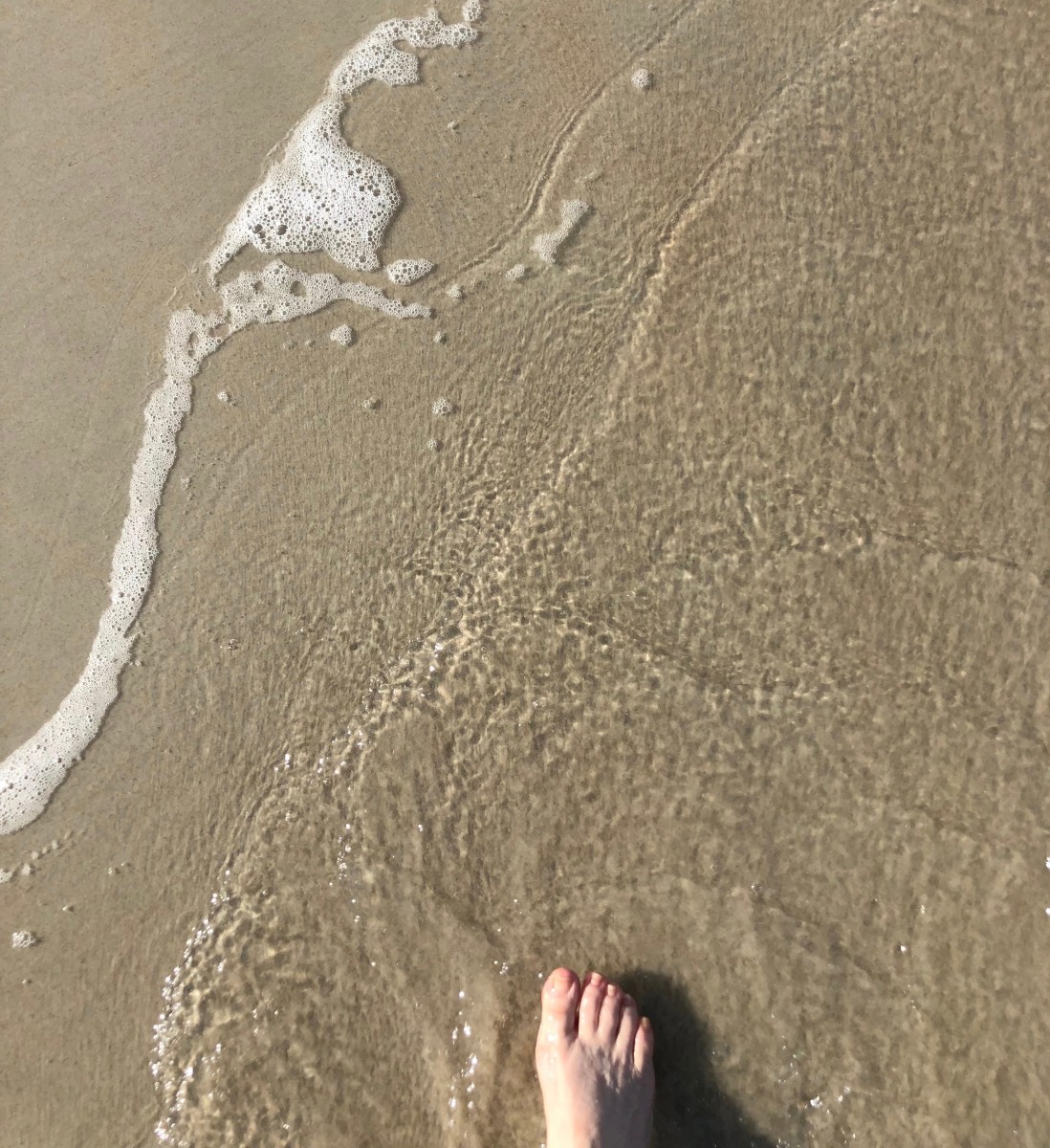 I love walking on the beach, and letting the waves lap over my toes.