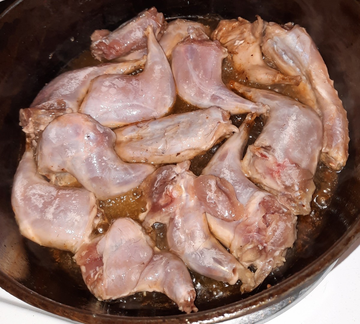 The larger amount of meat in this version of fried squirrel pushes the smaller amount of grease higher up the skillet. So, less grease actually achieves more coverage.