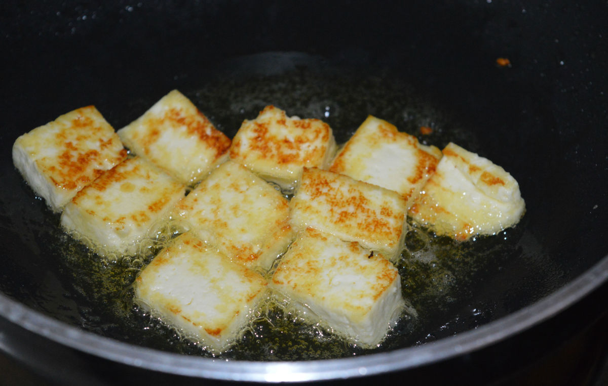 Step one: Saute the paneer cubes in oil until they become firm and lightly golden brown. Remove them and collect in a plate.