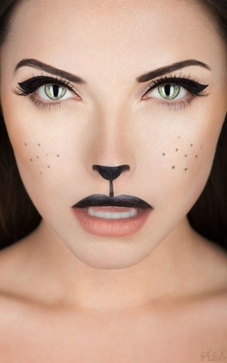 Photo of woman looking cool and sexy in simple cat makeup with black nose and lip 