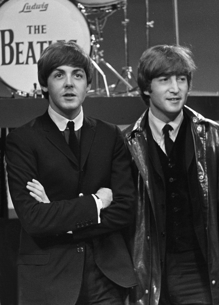 Paul McCartney (L) and John Lennon of The Beatles are one of the most successful songwriting duos ever.