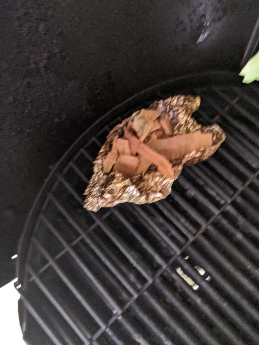 Wood chips in foil box to create smoke.