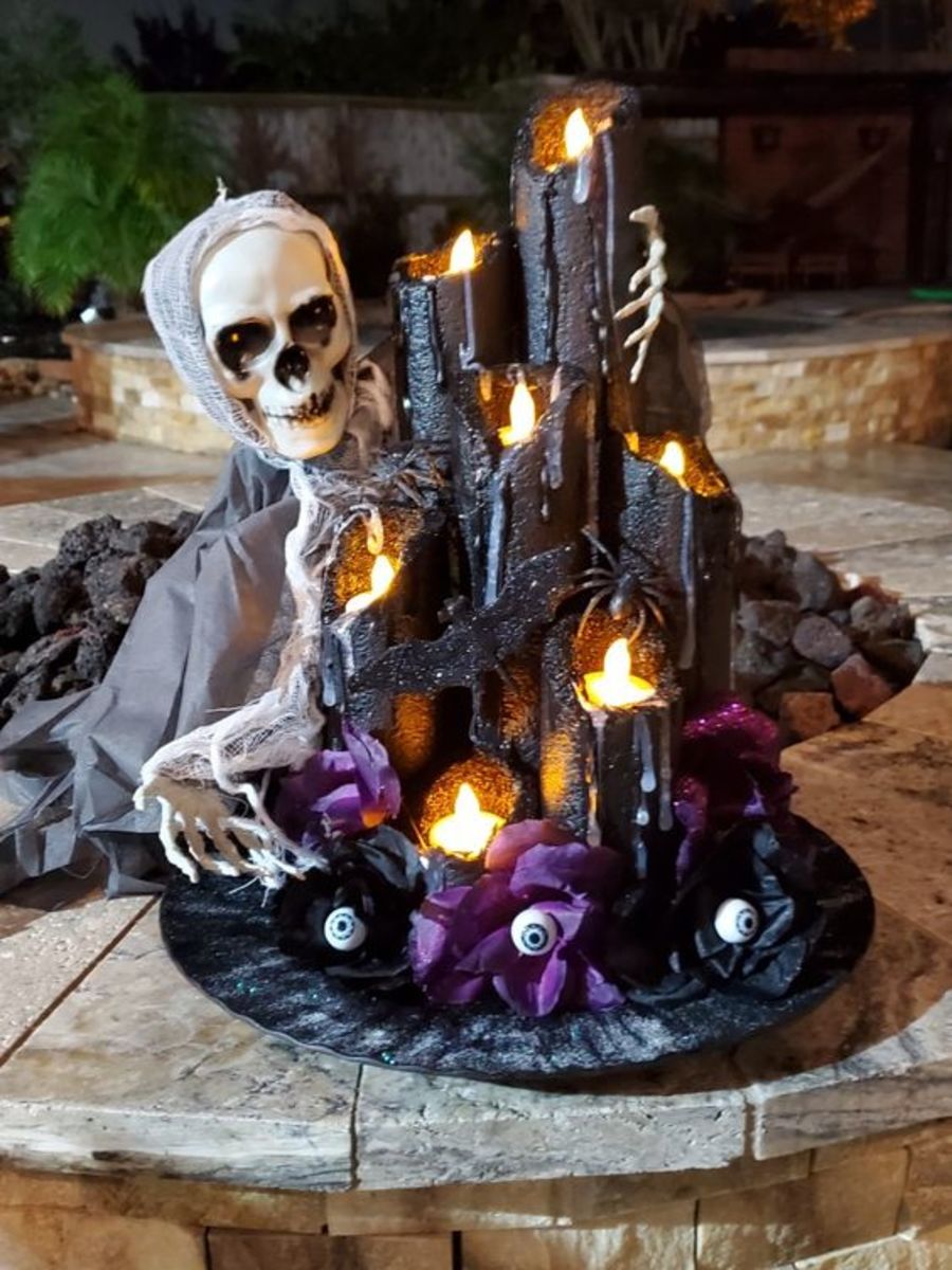 This ultra-spooky skeleton is posing with some creepy candles.