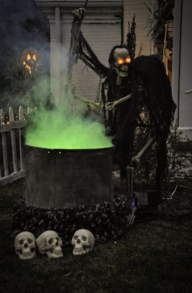 You can use LED lights to give your skeletons glowing eyes, and don't forget some creepy clothes. This display uses dry ice for the "bubbling" cauldron!