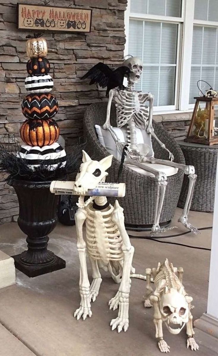 Good boy! These dog skeletons have helpfully fetched the paper. This is a great idea for a porch display!