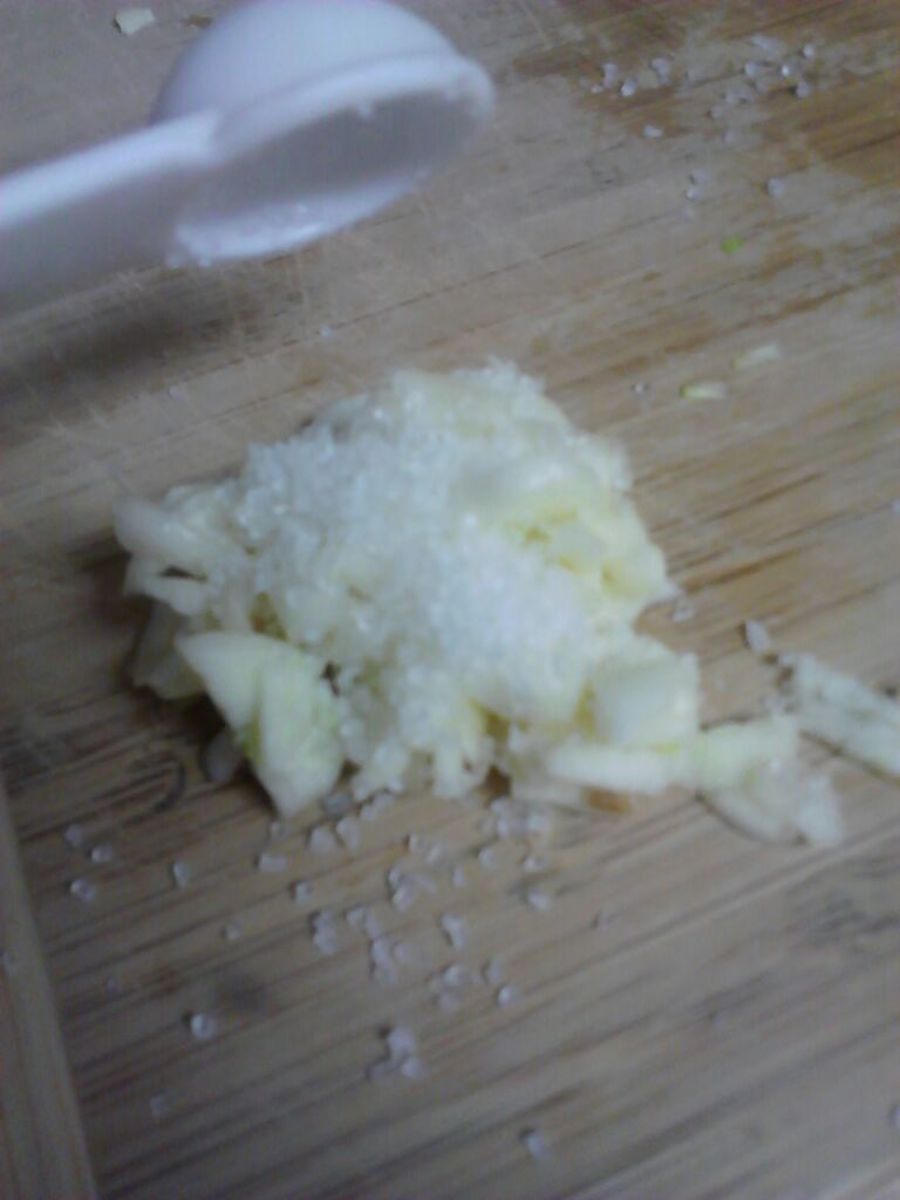 Sprinkle your chopped garlic with fresh coarse sea salt. 