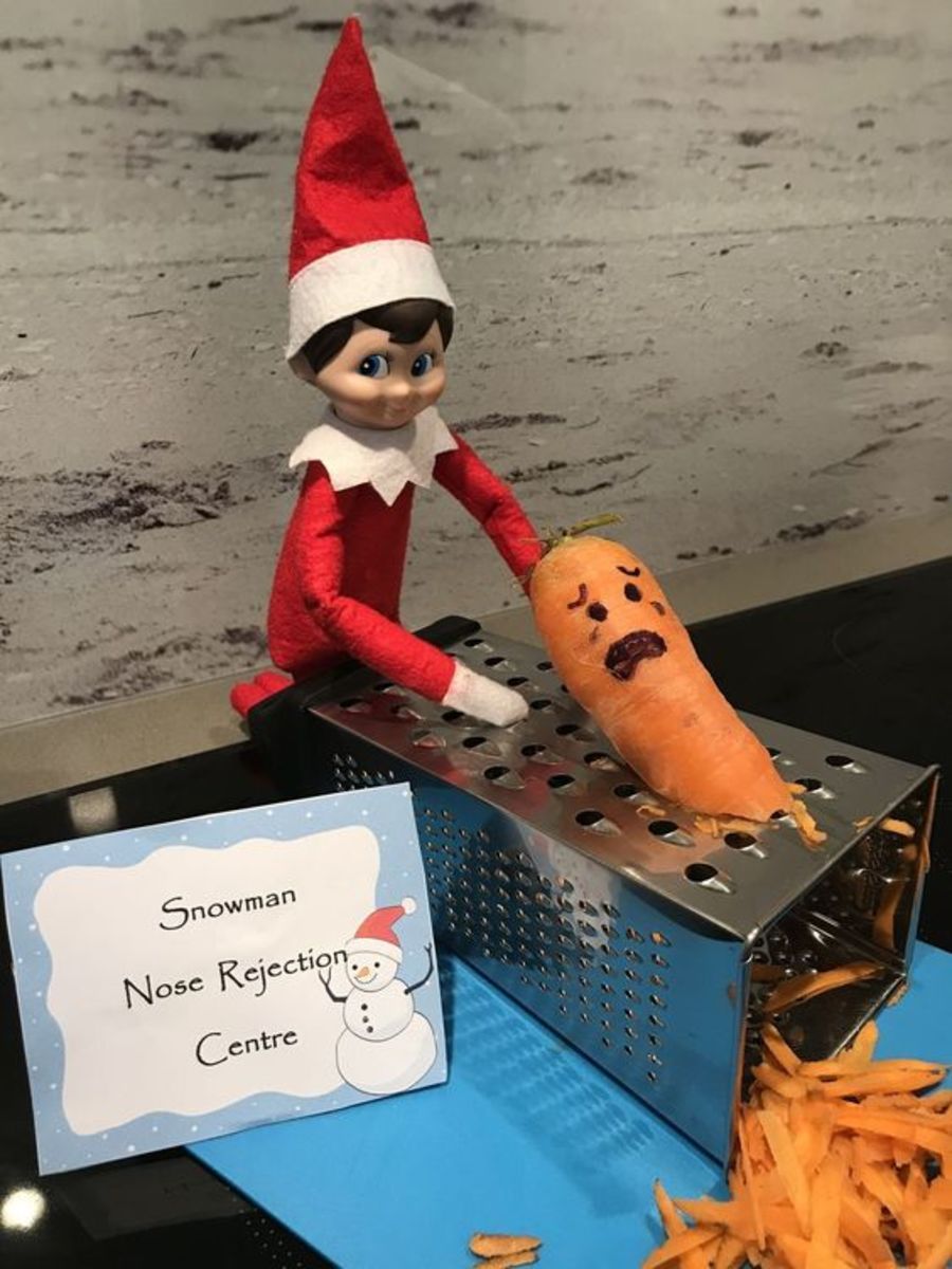 The elf doesn't like this snowman's nose. 
