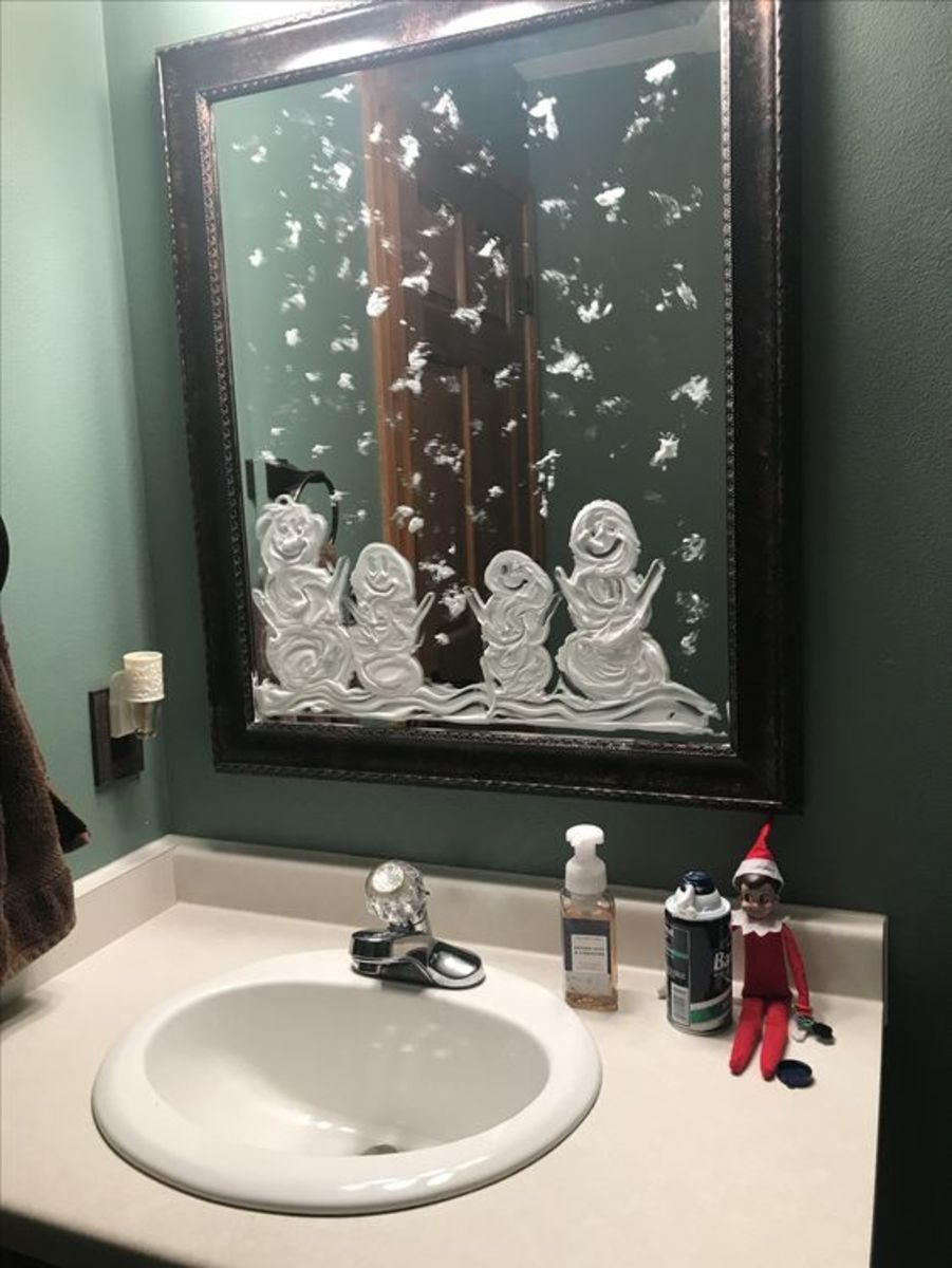 This elf decorated the bathroom with shaving cream. 