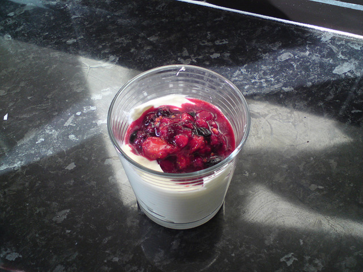 Berries and full fat unsweetened yoghurt are a healthy alternative to a biscuit or piece of cake.