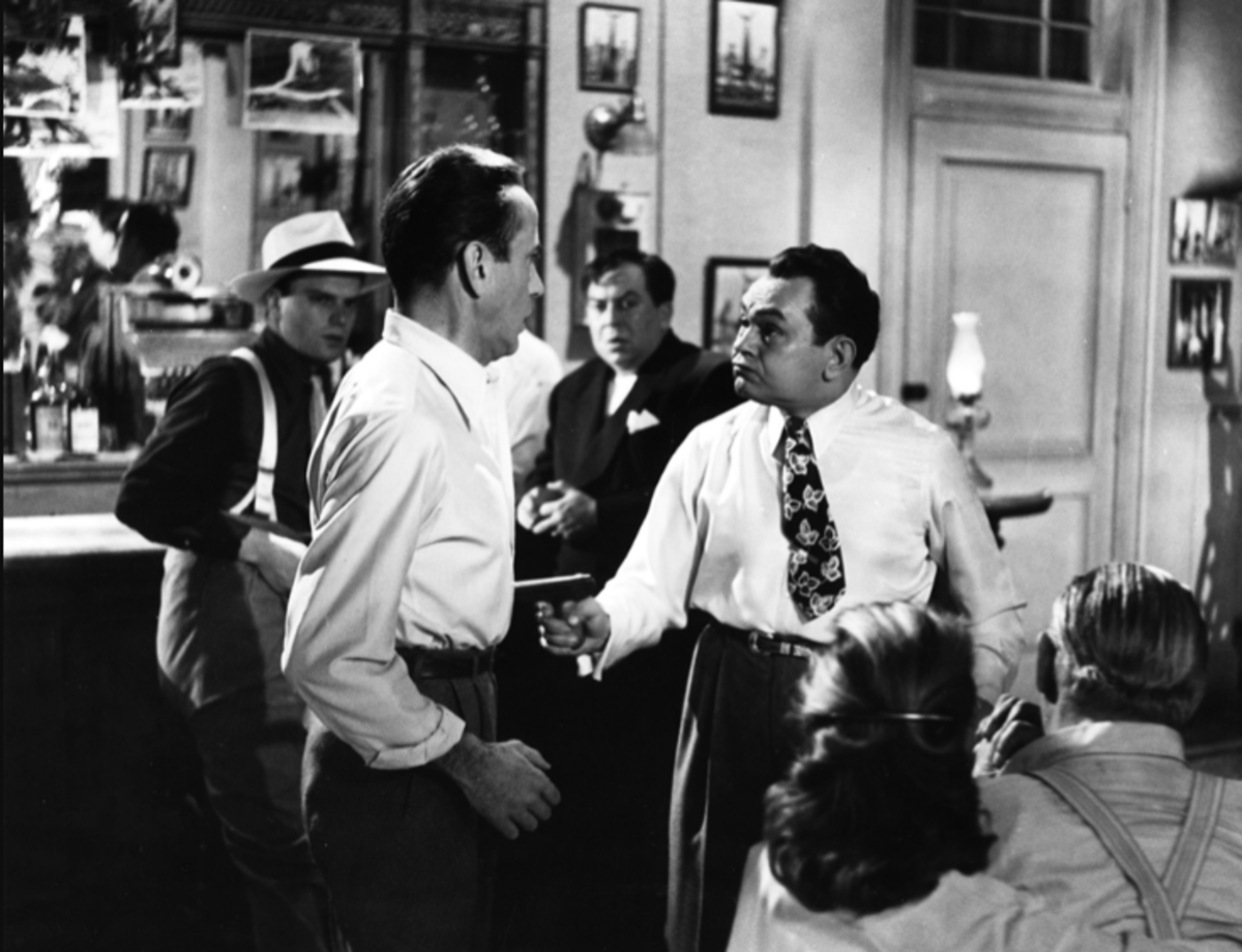 Rocco (Edward G. Robinson) forces Frank (Humphrey Bogart) to sail the gang down to Cuba.