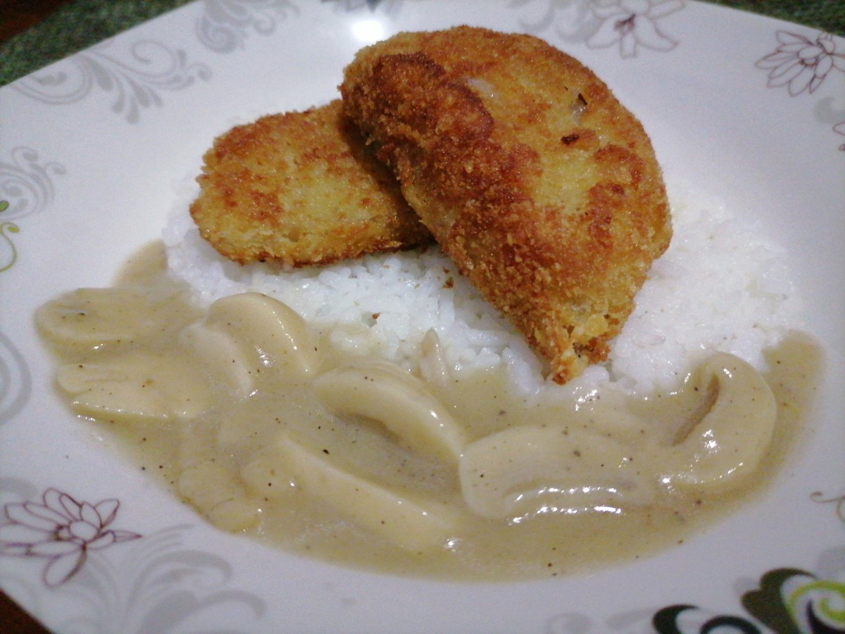 Breaded pork chops with mushroom gravy paired with rice  
