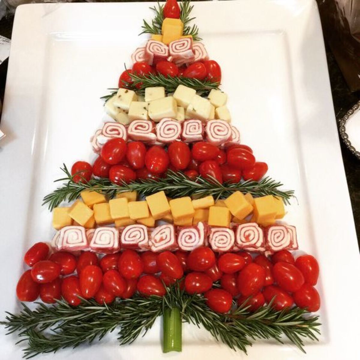 Christmas tree cheese platter with rolled-up meats