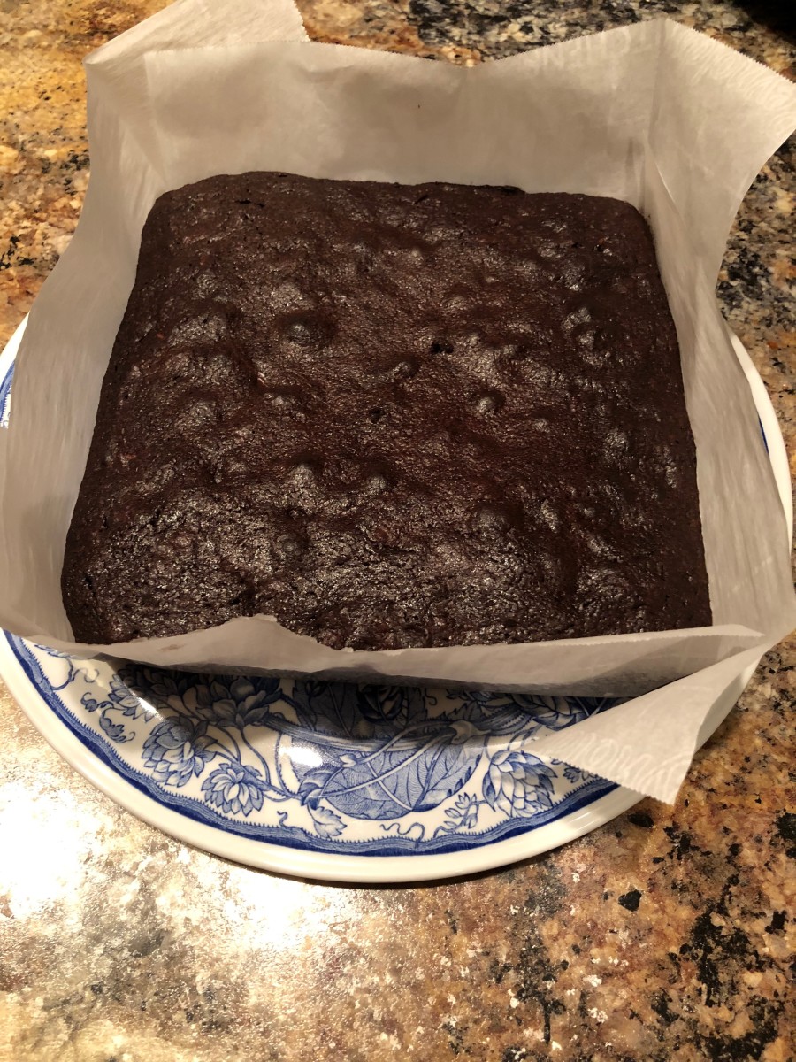 The uncut brownies are easily lifted out of the pan with the parchment paper.