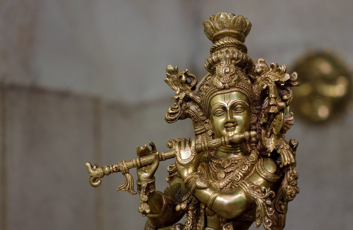 A statue of Lord Krishna representing the Lord playing the flute.