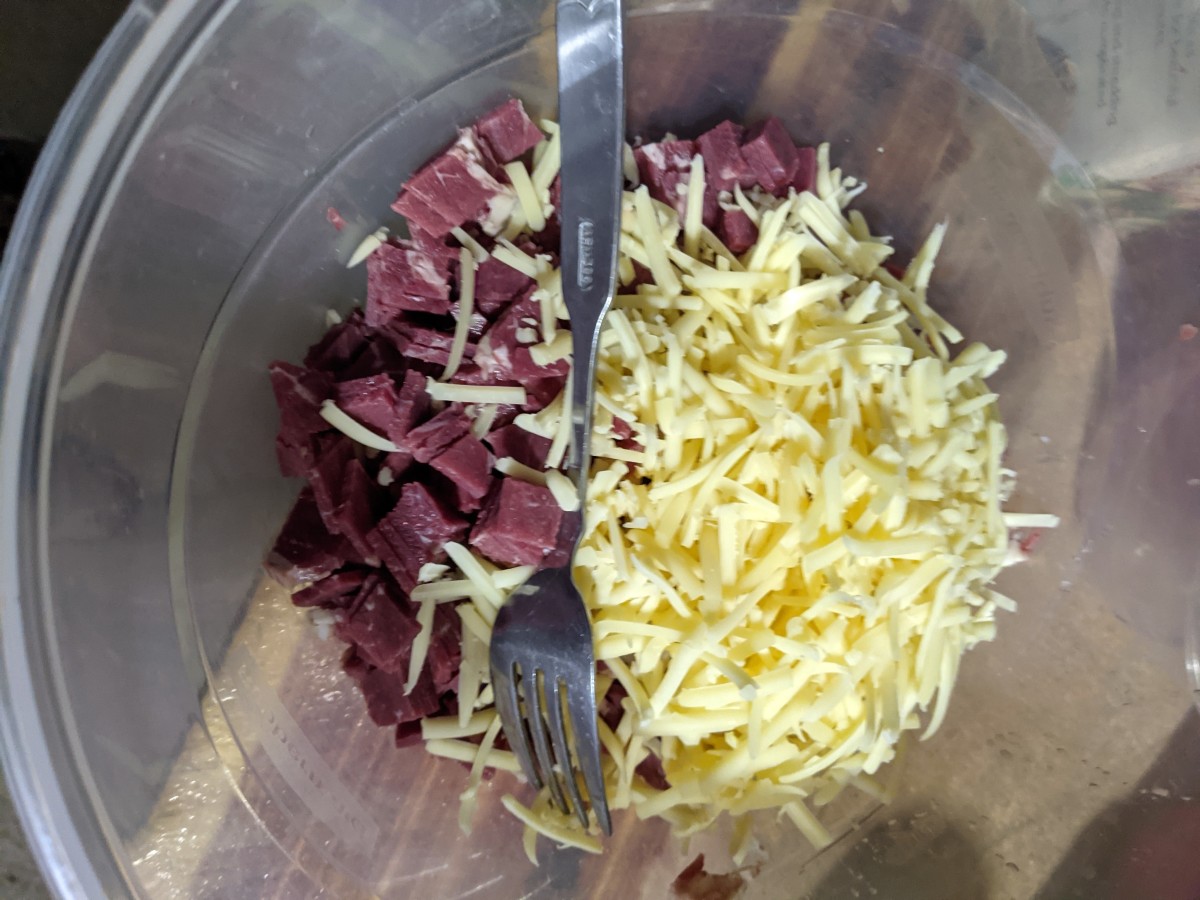 Add shredded cheese to beef.