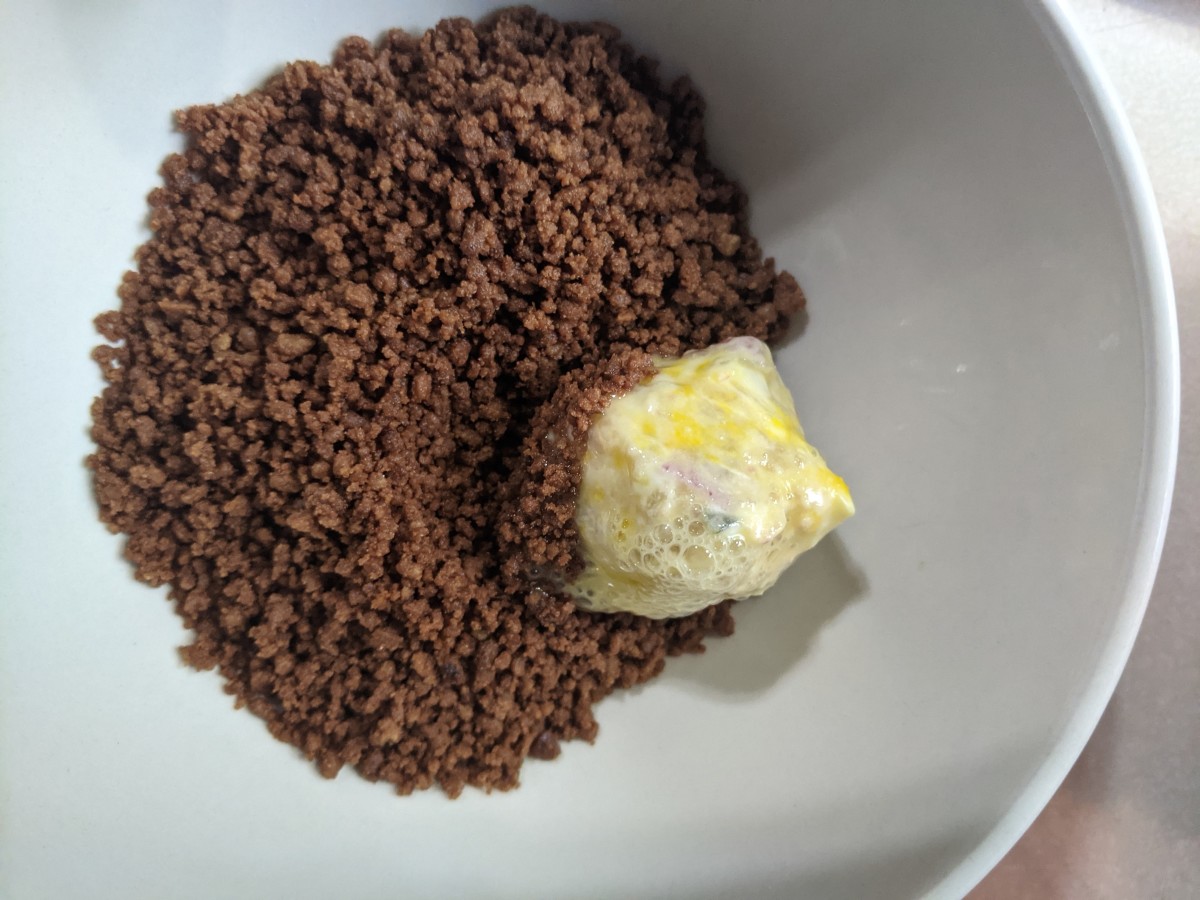 Dip egged ball into rye crumbs