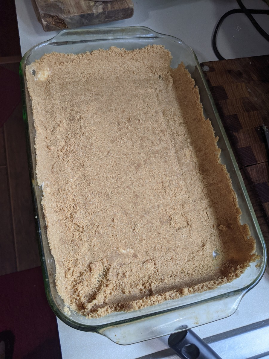 place graham cracker crumble mixture into glass baking dish. Let crawl up sides. Press into place.