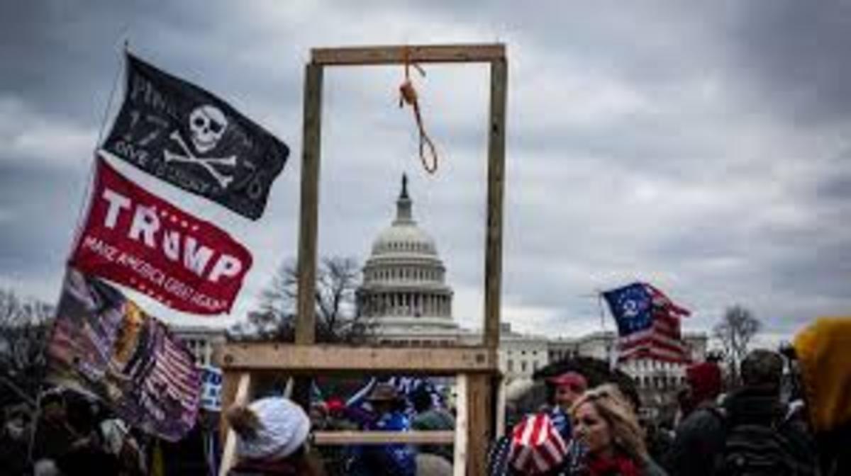 Mob storming Capitol with a symbolic noose hanging from a scaffold. A noose has many meanings in today's divided America. What did it mean on January 6?