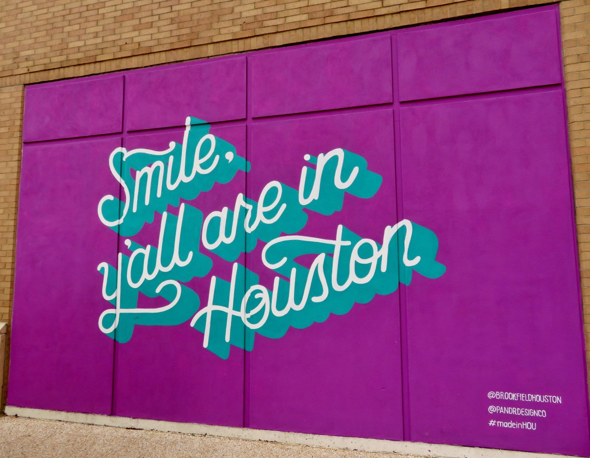 "Smile y'all are in Houston" mural by Pandr Design Co.