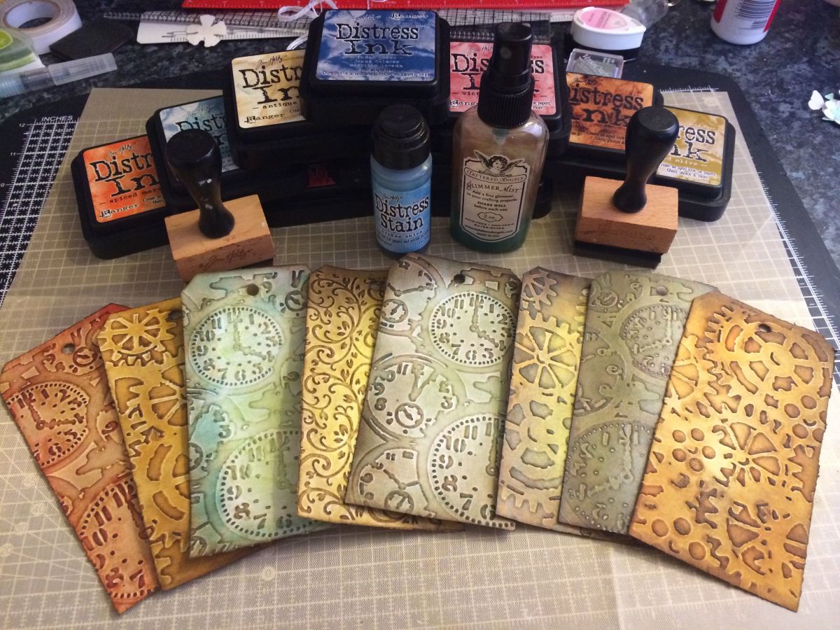 You can ink folders to make distressed inked embossed tags. Perfect for art and junk journals