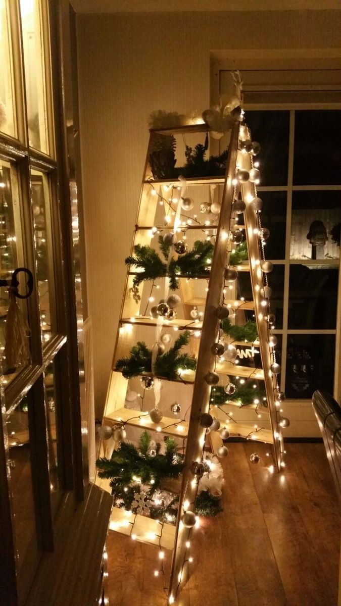 Big Ladder Covered With Lights, Evergreen Boughs and Ornaments