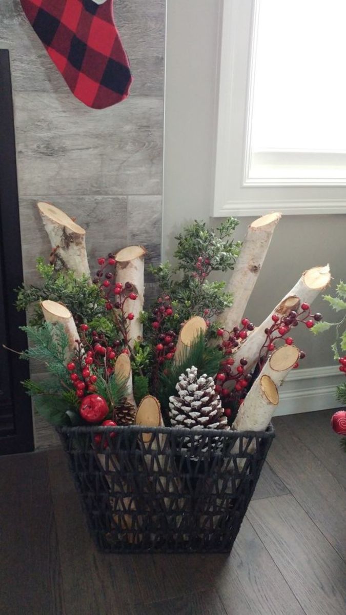 Floor Basket Filled With Birch Logs and Berry Sprays