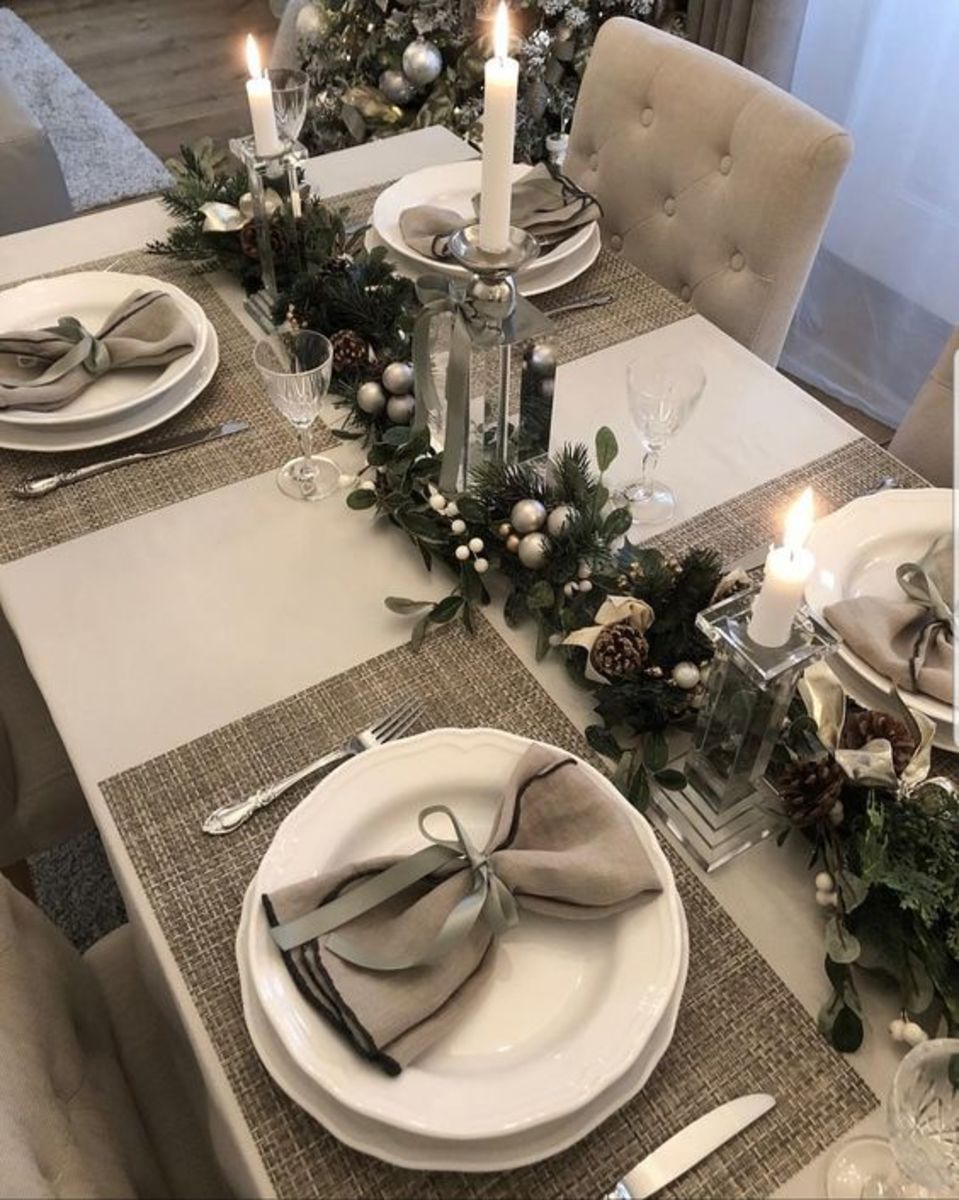 Faux Greenery Centerpiece With Silver Baubles and Tall Candles
