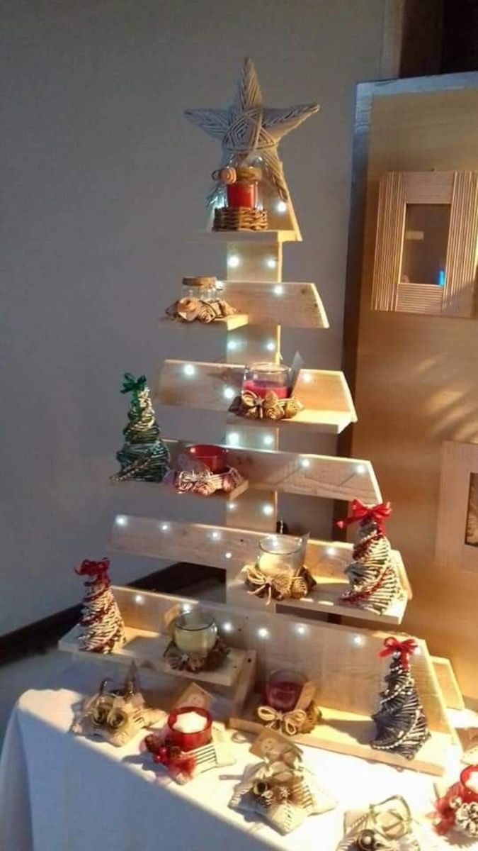This cute pallet tree displays miniature straw trees and pretty candles.