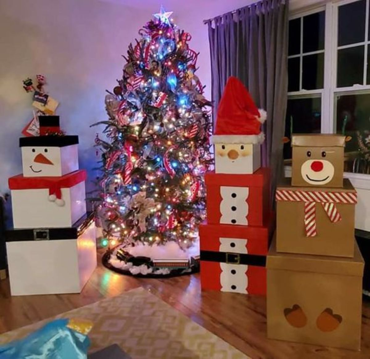 This amazing gift display features a snowman, reindeer and Santa!
