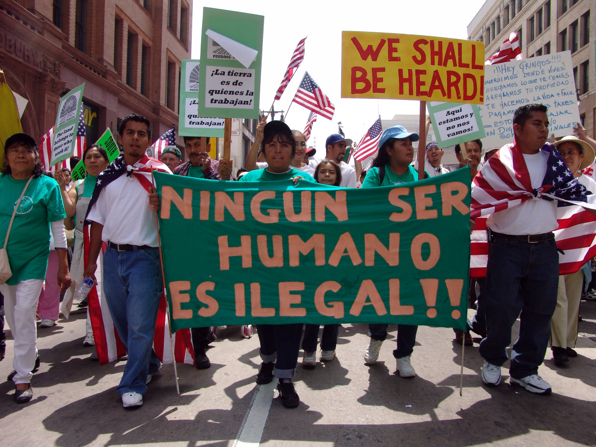 PROTEST FOR ILLEGAL ALIENS (SIGN SAYS "NO HUMAN IS ILLEGAL")