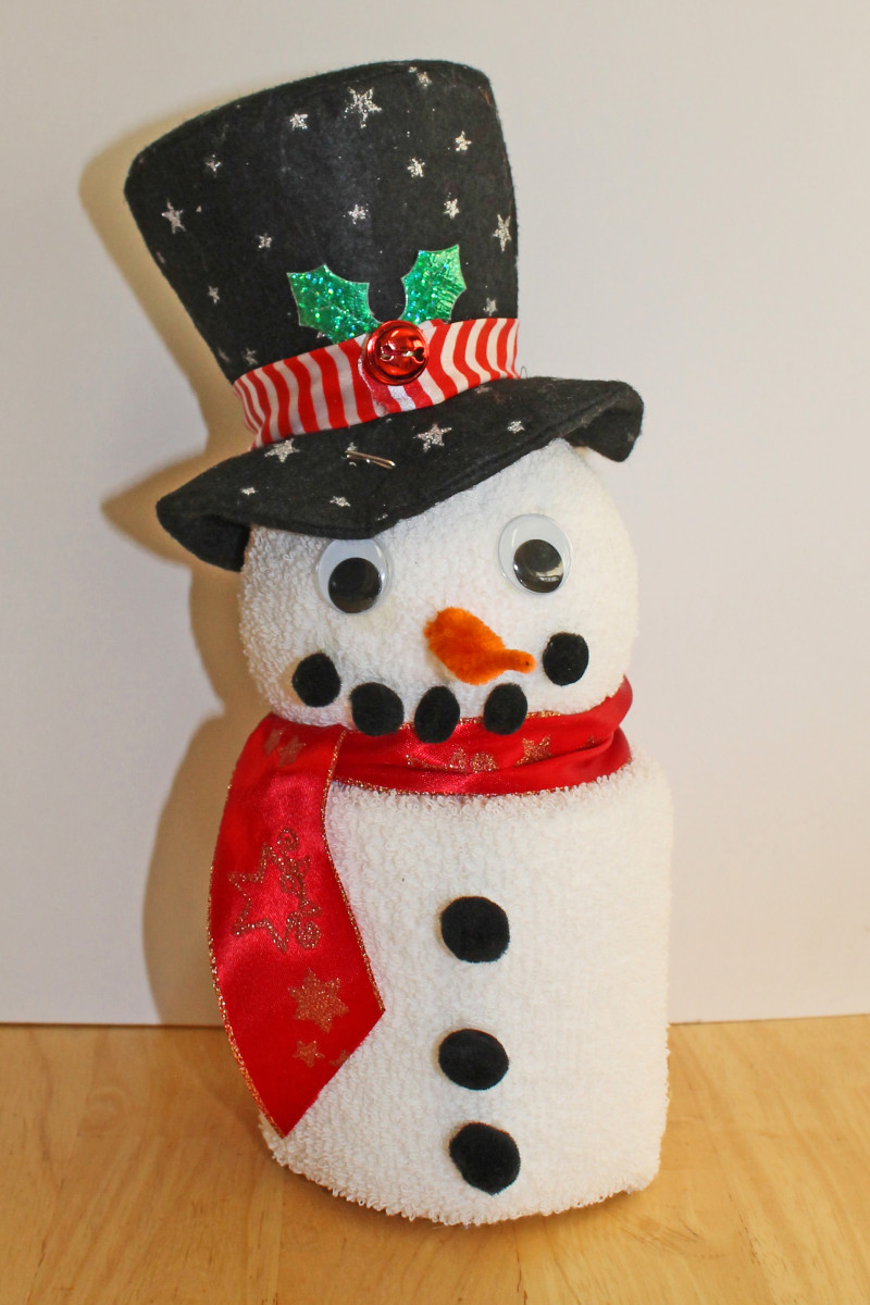 For this jaunty snowman, I used a little hat that came on a Christmas headband. The scarf is just a piece of ribbon tied around the neck.