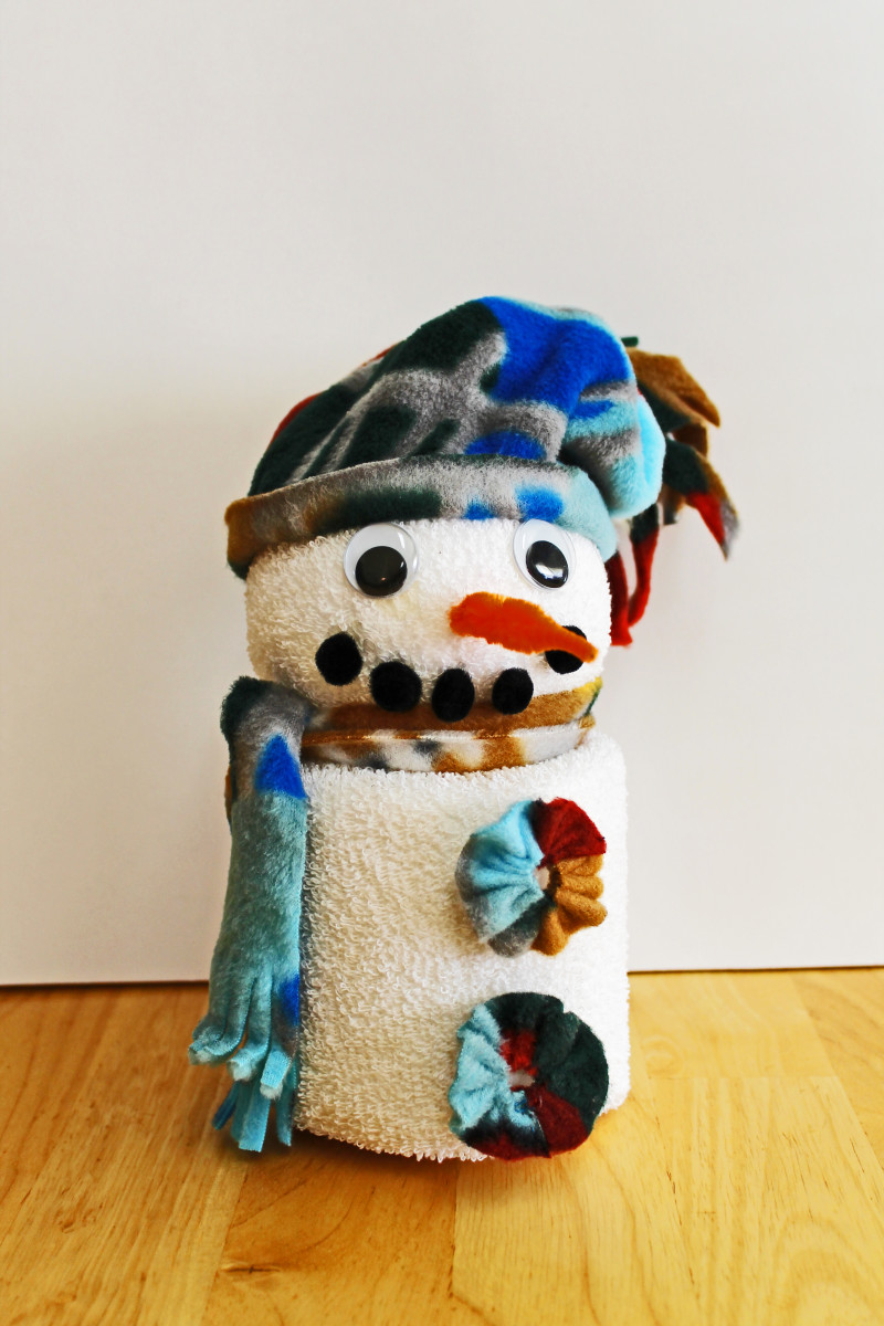 For this snowman, the hat, scarf and buttons were all made from leftover fleece.