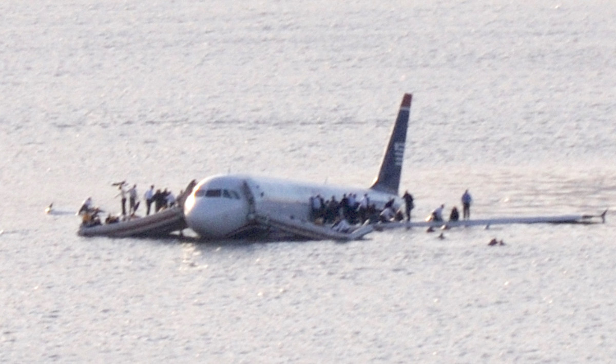 Passengers on the slowly sinking U.S. Airways Airbus 320 wait to be rescued. 