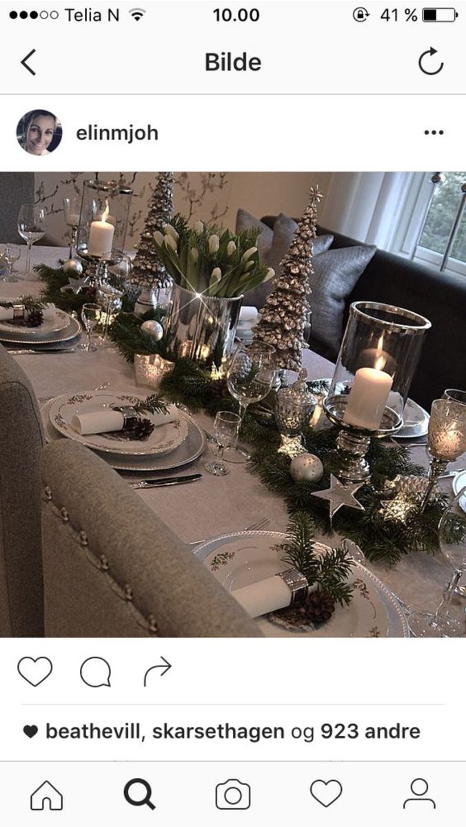 Set your table with large glass candle votives, mini silver Christmas trees and a dark grey table runner.