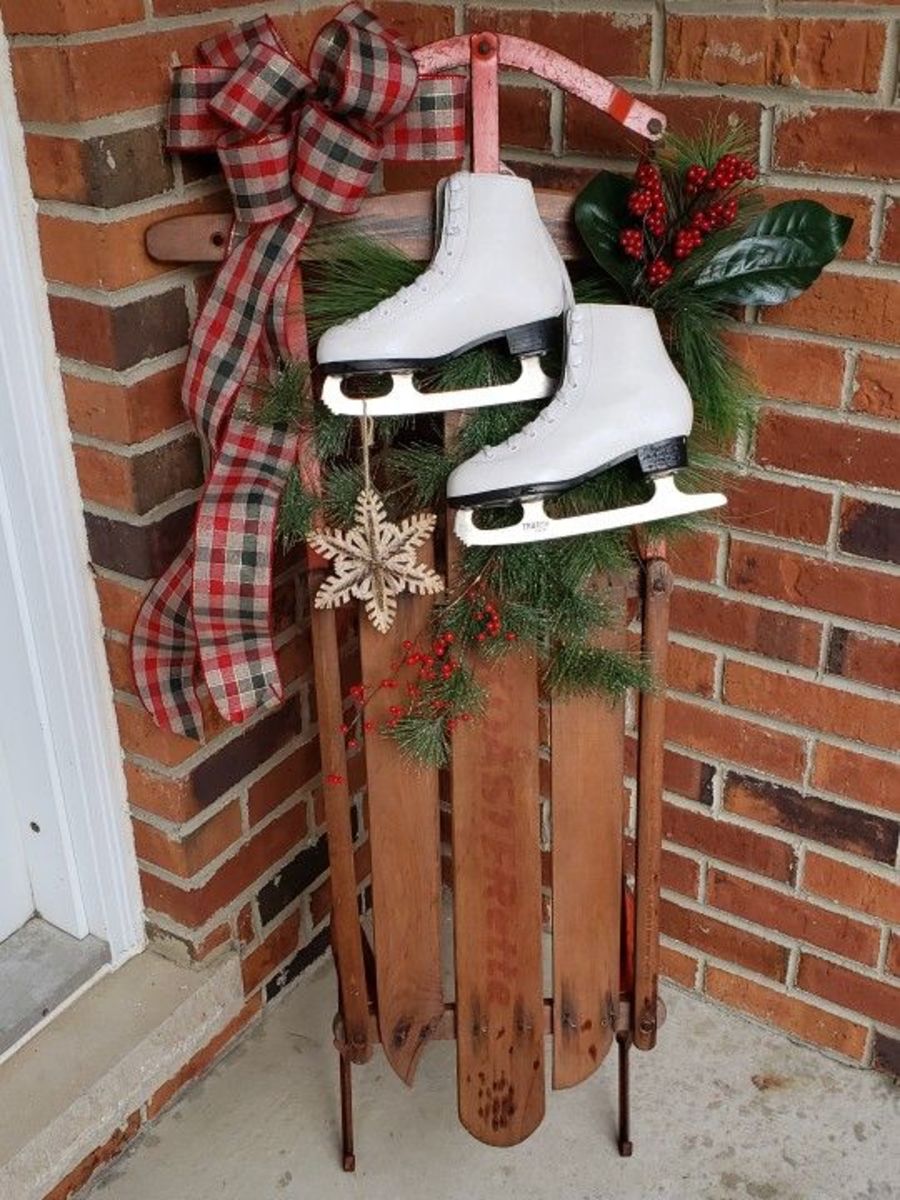Tie old ice skates to a sled, and decorate with Christmas greens and a bow.