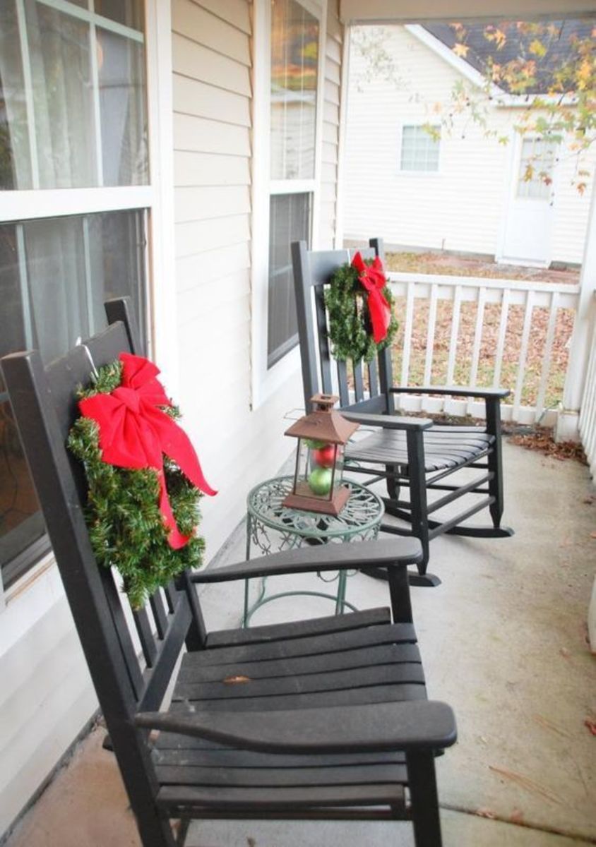 Add a simple red bow and some Christmas greens to your outdoor rocking chairs. They instantly become festive!