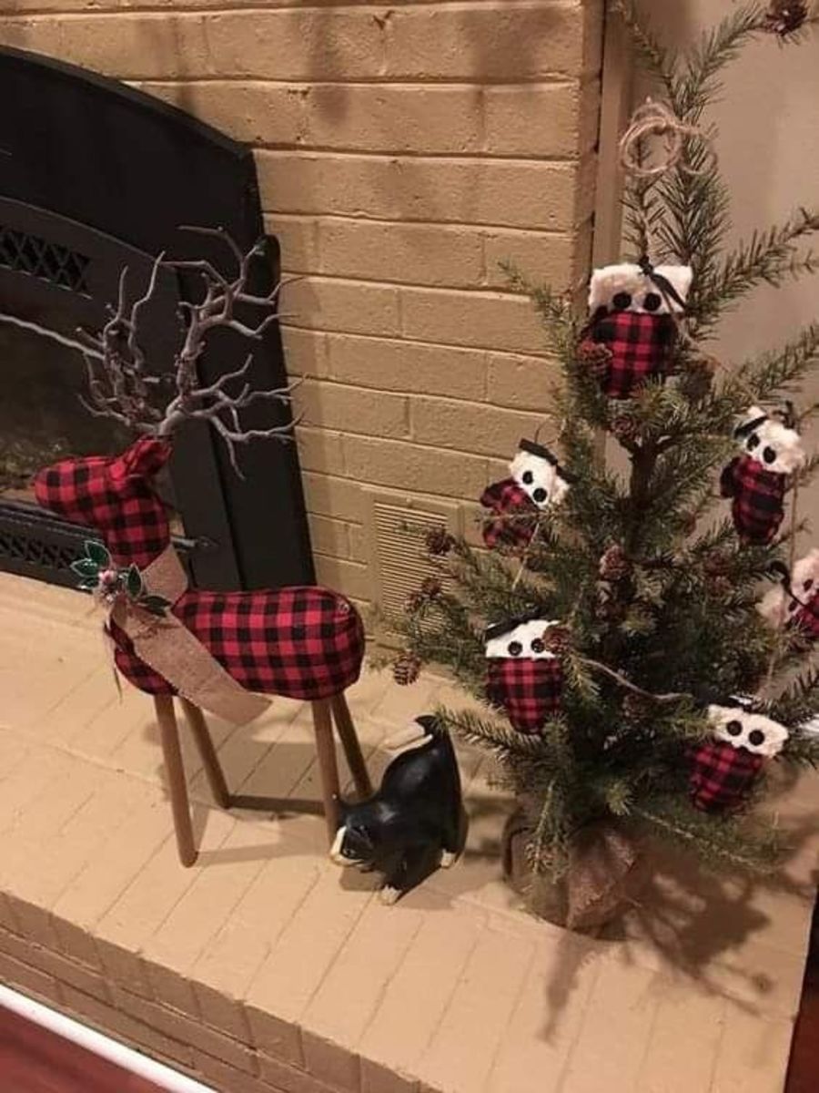 Go all out with buffalo plaid: Hang a mini Christmas tree with buffalo plaid ornaments, and place a plaid reindeer nearby!
