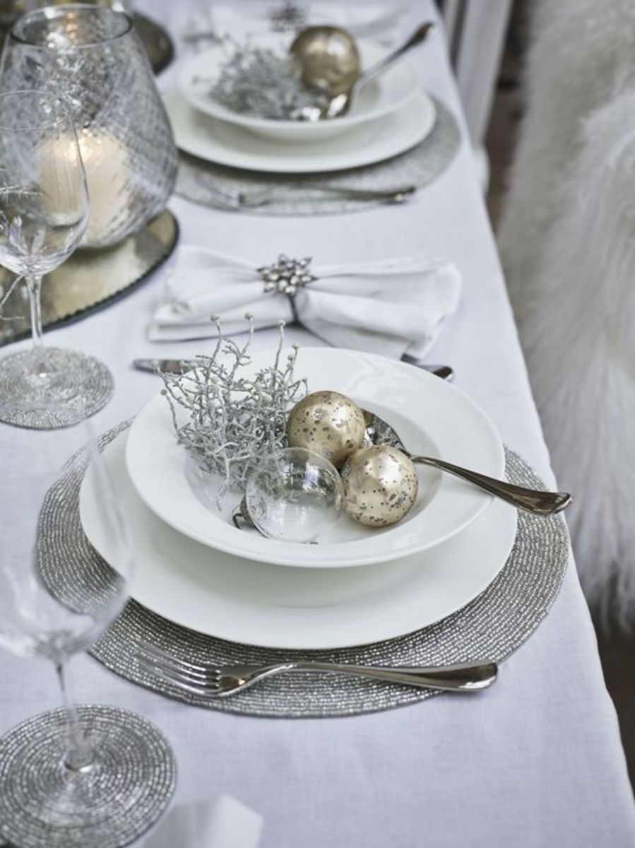 Bring out your silver service! Use silver placemats, baubles and nest decorations.
