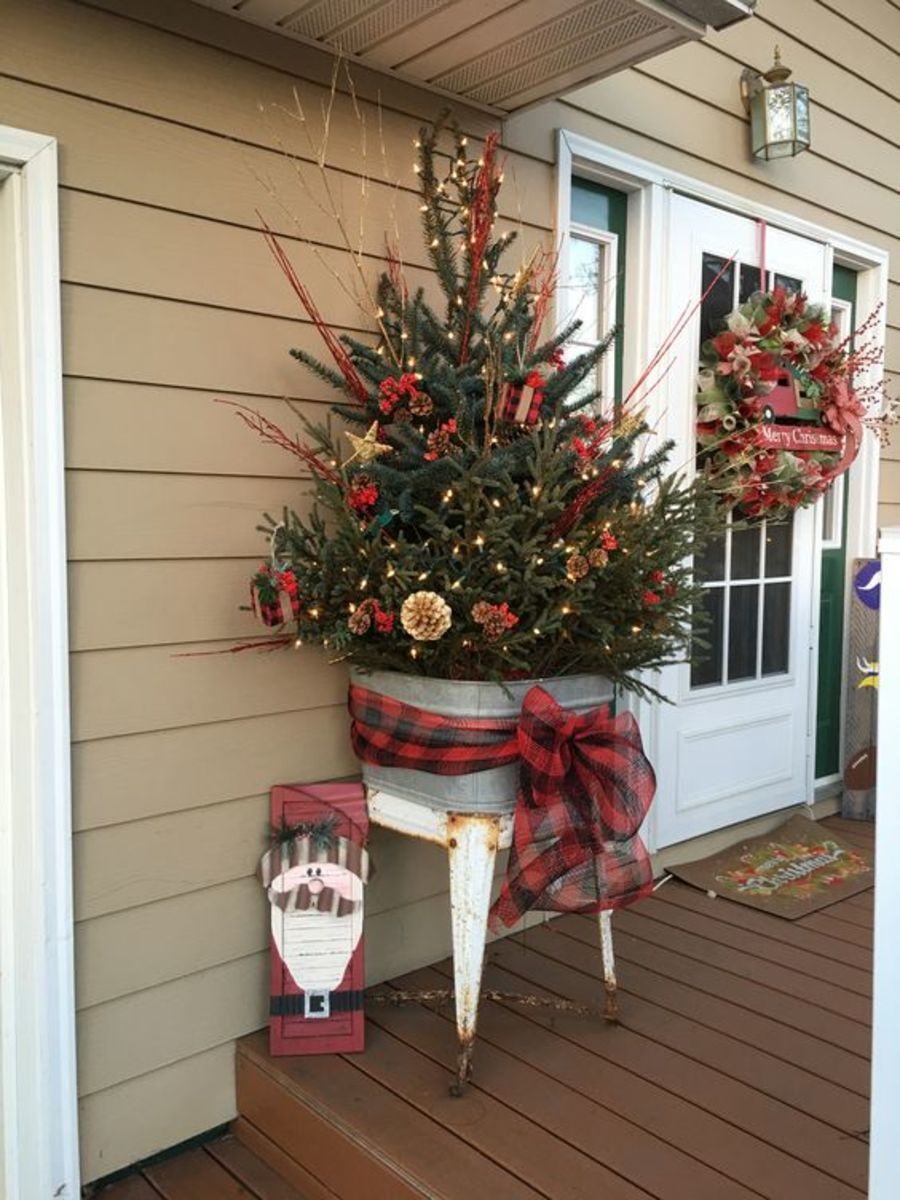 Place a medium-sized Christmas tree in a galvanized holder.