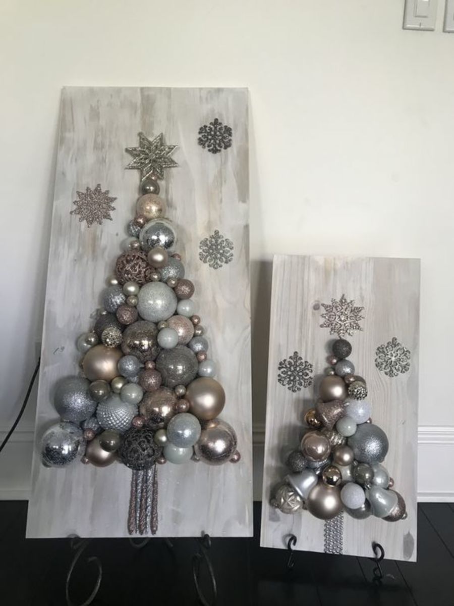 Make Christmas tree signs out of baubles and rustic wood planks.