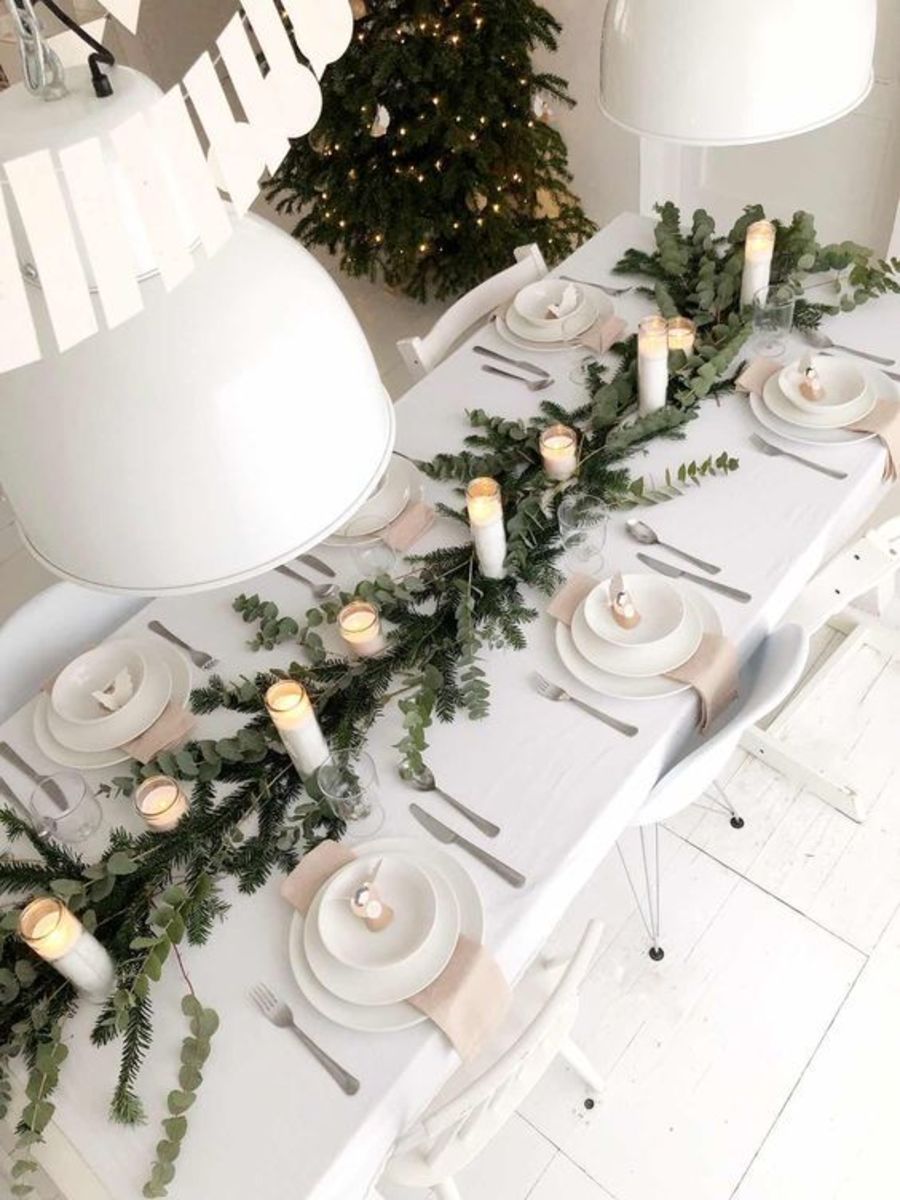 Combine classic white candles with Christmas greens.