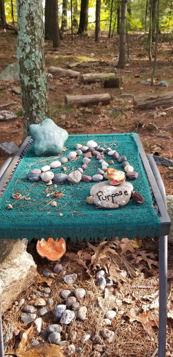 An arrangement of pebbles I crated on the altar at the center of the labyrinth to celebrate a wonderful weekend of camping with my son in October.